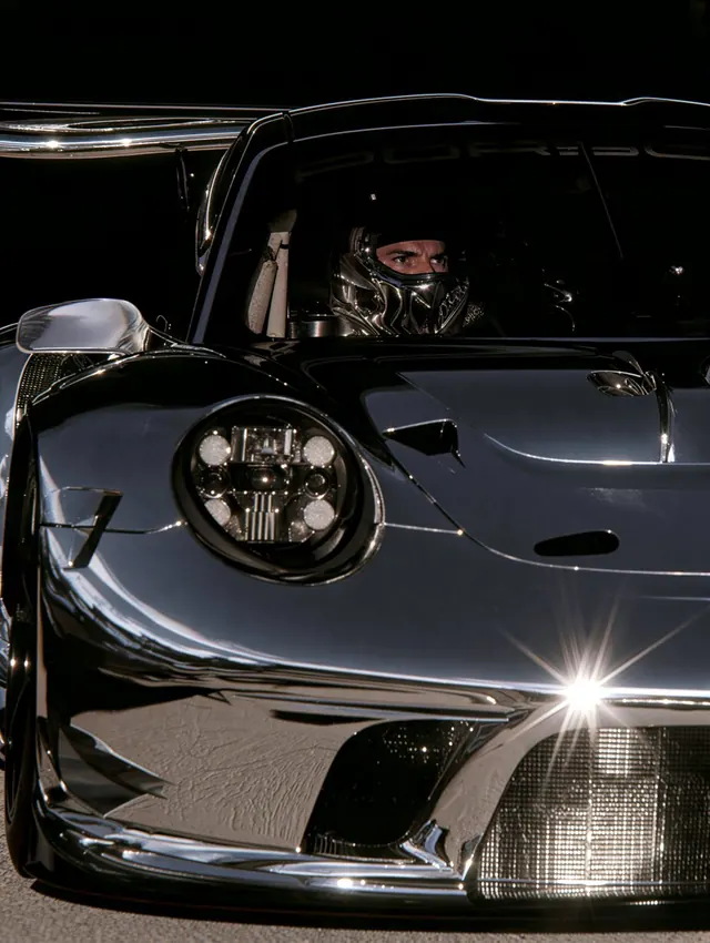 Chrome Driver and Headlight. Visual study of motorsport portrait, chrome racing car, helmet photography
