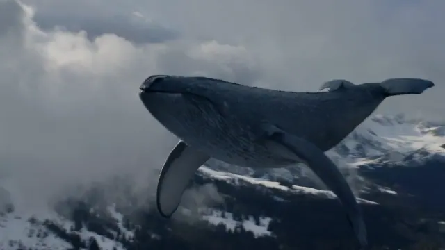 An enormous dark whale glides through clouds above layered snowy mountain peaks and distant forested valleys.